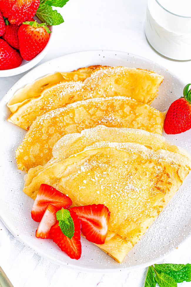 Classic Crepes - Tender, thin, delicate, buttery, and are wonderful with most any kind of filling from sweet to savory! Learn to make classic French crepes at home with just 6 COMMON ingredients! FAST, EASY, and NO special pans required! 
