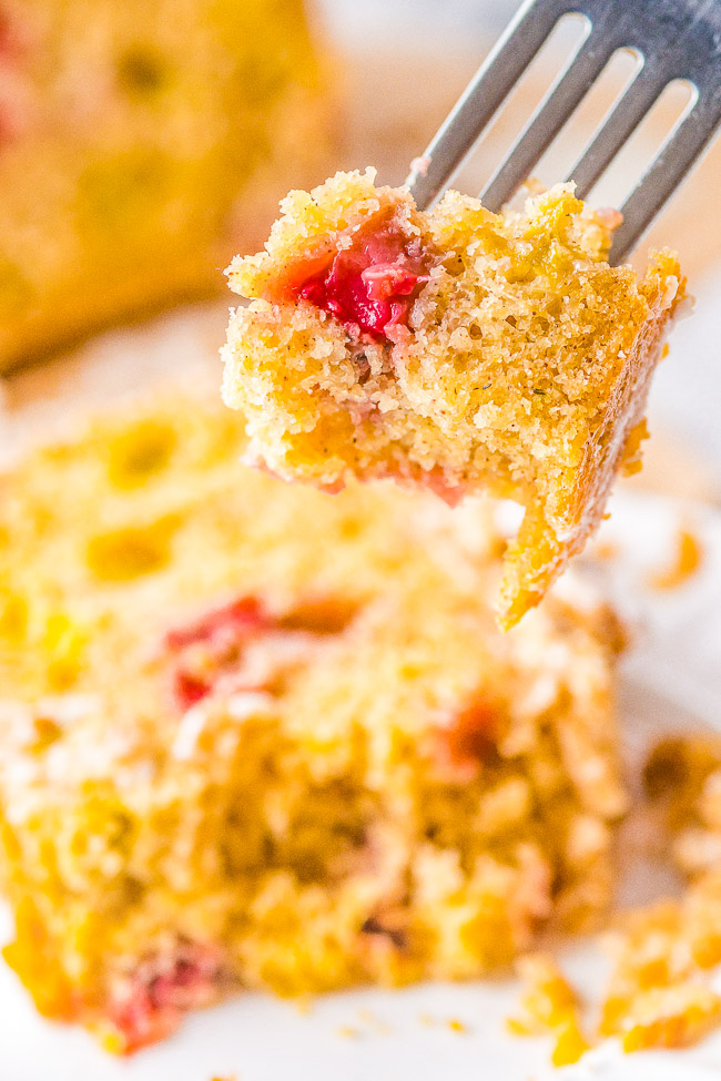 Strawberry Rhubarb Bread - This EASY, no-mixer quick bread is full of spring and summer flavors! Sweet strawberries and tart rhubarb are used to make this delightful bread that's topped with a buttery CRUMBLE and then GLAZED! that is perfect for breakfast or dessert!