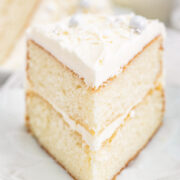 White Layer Cake - A classic, white, two-layer cake recipe for cake with a light texture that's complemented by super light and fluffy buttercream that's not too sweet! Learn how to make THE BEST white layer cake that's fancy enough to serve at your most special celebrations and events!