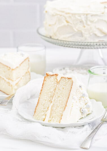 White Layer Cake – A classic, white, two-layer cake recipe for cake with a light texture that’s complemented by super light and fluffy buttercream that’s not too sweet! Learn how to make THE BEST white layer cake that’s fancy enough to serve at your most special celebrations and events!