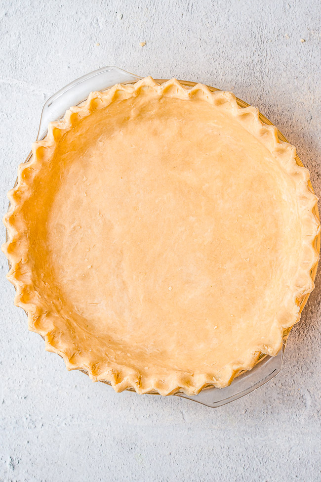 Easy Flaky All Butter Pie Crust - This perfect pie crust is so FLAKY and BUTTERY! It's EASY, no-fuss, and foolproof! It's great pre-baked to use in no-bake pies or for double-crust pies!