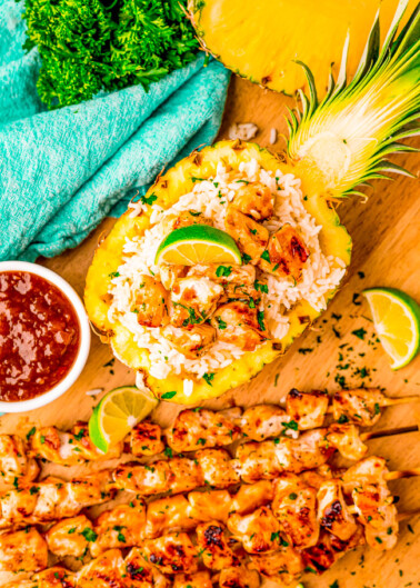 Pineapple Teriyaki Chicken Skewers - Fast, easy, and loaded with sweet-and-savory pineapple teriyaki flavor! Made with just a handful of basic ingredients, these grilled chicken skewers will be a family FAVORITE! Serve with coconut rice in a pineapple for a showstopping presentation!