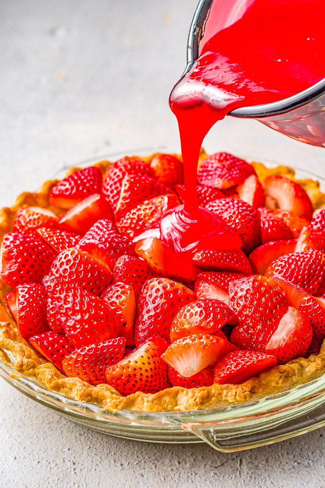 Fresh Strawberry Pie - This EASY strawberry pie is bursting with juicy, fresh strawberries and covered in a delicious glaze! Use a homemade flaky crust OR a refrigerated store bought crust for this amazing pie that everyone LOVES! Only SIX main ingredients!