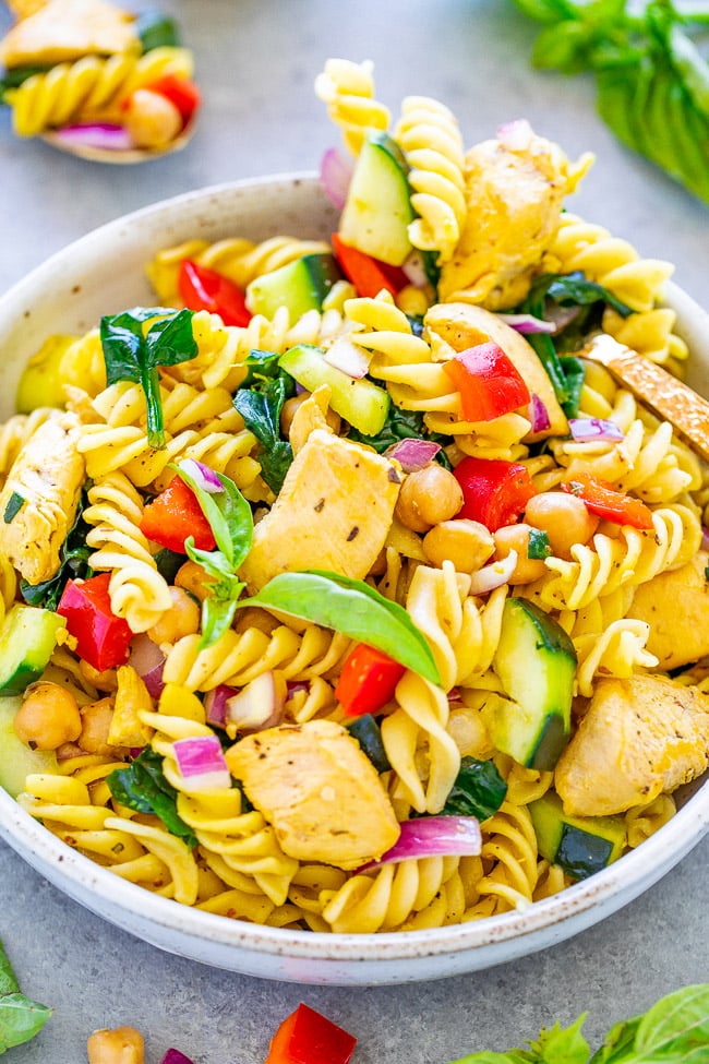 Mediterranean Lemon Chicken Pasta Salad - This chicken pasta salad is loaded with flavor, ready in minutes, and showcases Mediterranean-inspired ingredients! It’s perfect for summer potlucks and barbecues (no mayo!) and feeds a crowd. Or make it as an EASY family dinner with planned leftovers!