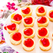 Mini Cherry Cheesecakes - Fun and adorable mini cheesecakes have a crunchy graham cracker crust, a creamy cheesecake filling, and are topped with cherry pie filling but you can top them with anything you’d like! EASY, sure to impress, and mini food always tastes BETTER!