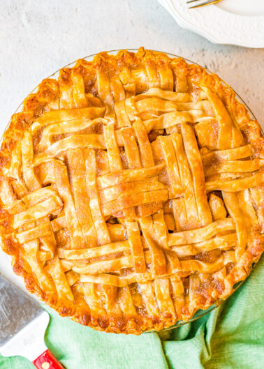 Best Homemade Apple Pie - This fabulous apple pie is a specialty of my grandma's. The sauce for the apples is slowly poured over the lattice crust until it fills the shell.  When it bakes, the top has a nice crispy coating over the flaky crust. The center is full of sweet and tart tender apples with just the right amount of cinnamon and sugar. This really is the BEST apple pie!