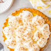 Coconut Cream Pie – Homemade coconut cream pie that will become a family FAVORITE! There’s a luscious coconut filling, a creamy top, and this EASY from-scratch pie is loaded with coconut flavor because coconut is used four different ways! Use store bought crust to save time!