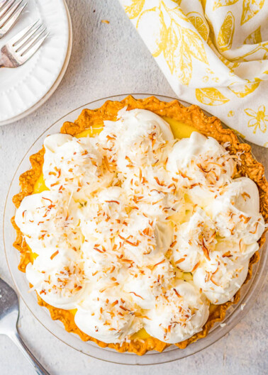 Coconut Cream Pie – Homemade coconut cream pie that will become a family FAVORITE! There’s a luscious coconut filling, a creamy top, and this EASY from-scratch pie is loaded with coconut flavor because coconut is used four different ways! Use store bought crust to save time!