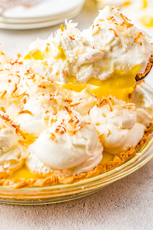 Coconut Cream Pie - Homemade coconut cream pie that will become a family FAVORITE! There's a luscious coconut filling, a creamy top, and this EASY from-scratch pie is loaded with coconut flavor because coconut is used four different ways! Use store bought crust to save time!