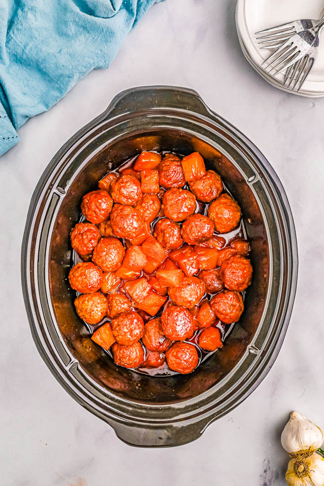 Slow Cooker Hawaiian Meatballs - The EASIEST meatball recipe that's sure to be a hit at parties and events! Or turn this into a no-fuss weeknight meal and serve these pineapple-infused Hawaiian meatballs over rice! Made with only 6 ingredients so you can just set your slow cooker and let it do all the work!