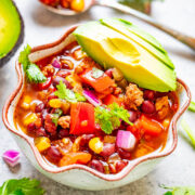 A bowl of easy 3-minute taco soup topped with avocado.