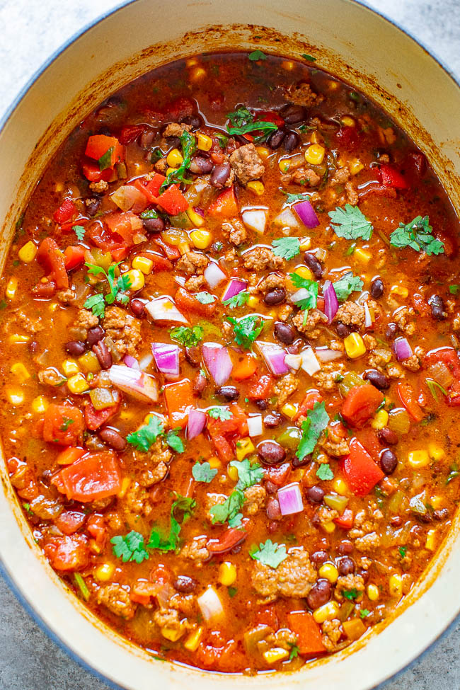 Easy 30-Minute Taco Soup - Taco lovers are going to love this beef taco soup which is like eating tacos but in soup form! Layers of Mexican-inspired flavors in this comforting and hearty yet healthy soup that will become a family FAVORITE! Fast, easy, one pot, and perfect for busy weeknights!
