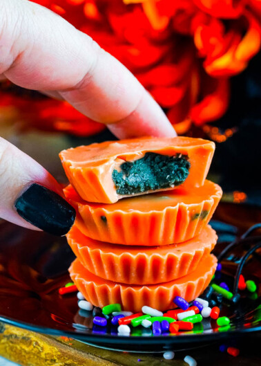Halloween Peanut Butter Cups - Learn how to make peanut butter cups with this EASY FIVE INGREDIENT RECIPE! With festive Halloween colors, they're sure to be a hit with everyone from kids to adults alike! They keep perfectly for weeks so feel free to make them in advance and pass them out at your Halloween parties and festivities!