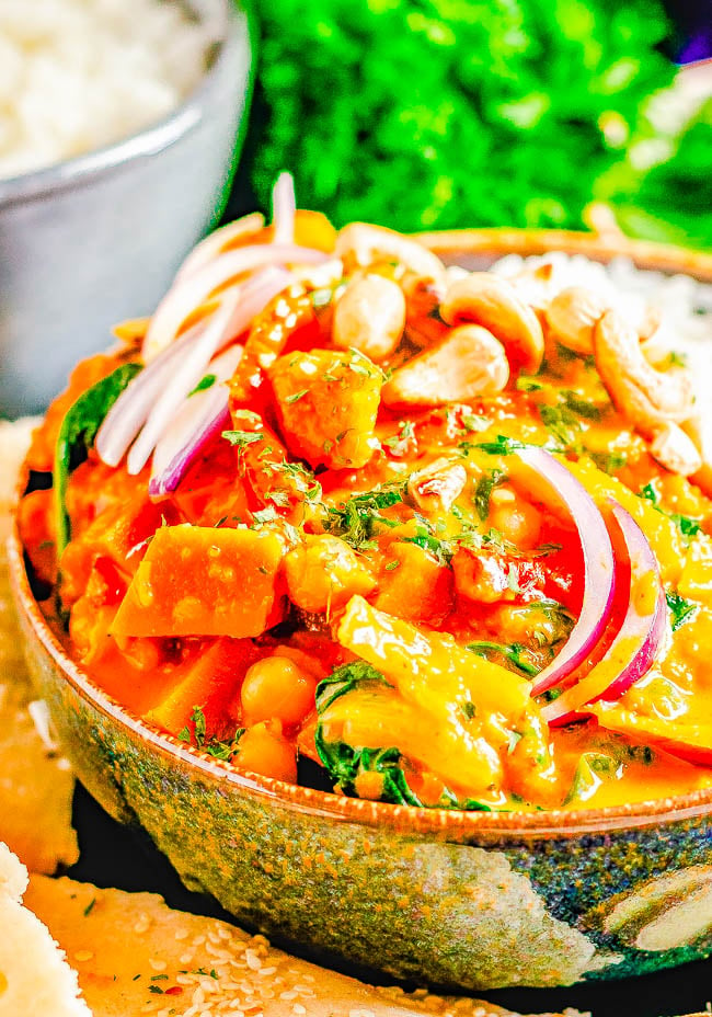 Thai Pumpkin Curry with Chickpeas — An EASY curry that's ready in 30 minutes! Tender fresh pumpkin, chickpeas, bell peppers, spinach, and more all bathed in the most aromatic Thai-inspired coconut milk broth! If you love Thai food, skip the restaurant and make this better-than-takeout curry at home!
