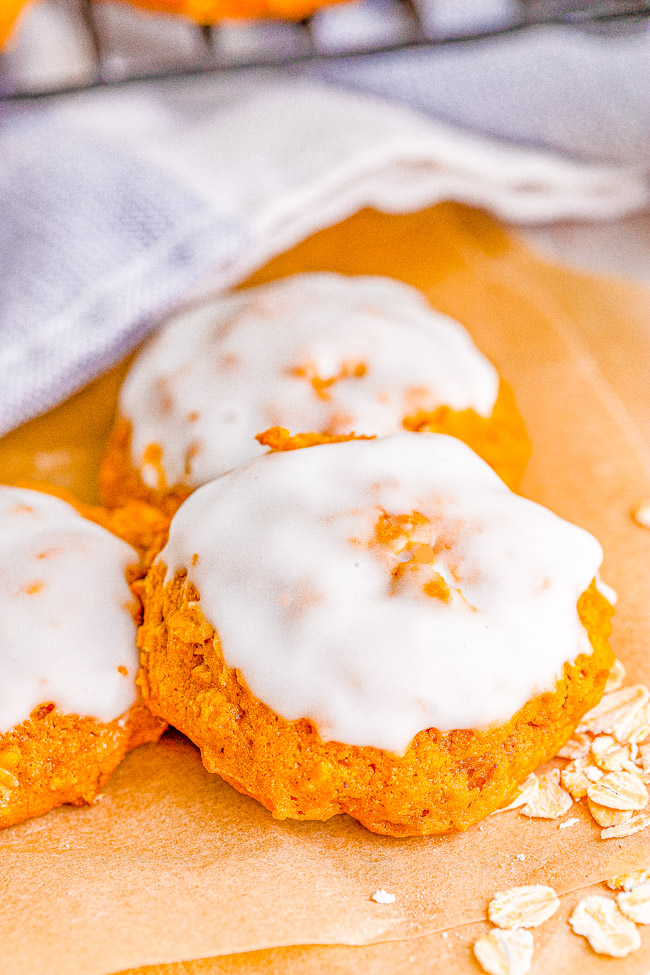 Iced Pumpkin Oatmeal Cookies - Soft and pillowy pumpkin cookies that are chock full of pumpkin spice and everything nice! The icing takes these cookies over the top. An EASY pumpkin oatmeal cookie recipe that does NOT require any dough chilling, making these a FAST treat to whip up!