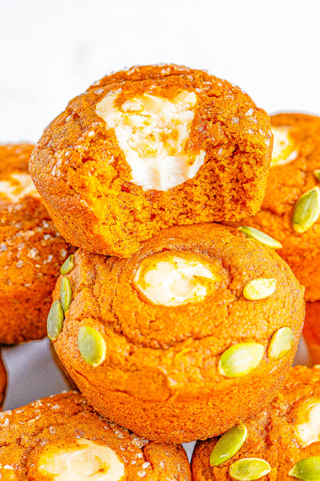 Starbucks Copycat Pumpkin Cream Cheese Muffins - Easy recipe for copycat pumpkin cream cheese muffins that are even BETTER than Starbucks! Super soft, moist, brimming with pumpkin spice flavor, and filled with tangy-sweet cream cheese! You are going to LOVE being able to replicate the coffee shop fall favorite at home in no time! 