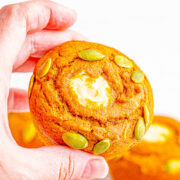 Starbucks Copycat Pumpkin Cream Cheese Muffins - Easy recipe for copycat pumpkin cream cheese muffins that are even BETTER than Starbucks! Super soft, moist, brimming with pumpkin spice flavor, and filled with tangy-sweet cream cheese! You are going to LOVE being able to replicate the coffee shop fall favorite at home in no time! 