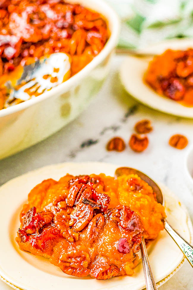Candied Bacon Sweet Potato Casserole - If you thought sweet potato casserole couldn't get any better, wait until you taste it topped with candied bacon and pecans! The sweet potatoes are smooth and creamy and the candied bacon topping is the perfect texture and flavor contrast! A WONDERFUL family-favorite side dish for Thanksgiving, Christmas, holiday parties and events that's easy to prepare with make-ahead directions! 