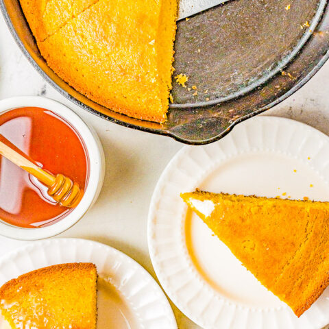 Classic Skillet Cornbread - Moist, fluffy, homemade cornbread prepared in a cast iron skillet for a crispy edge. The buttery subtle sweetness makes it a cross between a side dish and a stand-alone comforting snack. Whether you make it for a weeknight family dinner or a holiday celebration, it's so EASY, ready in 30 minutes, and FOOLPROOF!