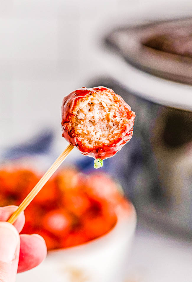 Slow Cooker Grape Jelly Meatballs - The EASIEST holiday appetizer that's made with just 3 INGREDIENTS! People adore these saucy meatballs loaded with FLAVOR! A perfect appetizer for Thanksgiving, Christmas, New Year's celebrations and holiday parties. Or make them for your next tailgating or game day party!