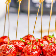 Slow Cooker Grape Jelly Meatballs speared with toothpicks.