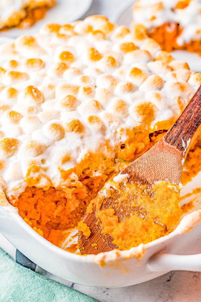 Classic Marshmallow Sweet Potato Casserole - An EASY recipe for the BEST classic marshmallow sweet potato casserole with pecans! Tender and creamy sweet potatoes, the subtle crunch of a buttery pecan crumble, and gooey marshmallows make this comfort food side dish an automatic family FAVORITE! It'll be on repeat for your Thanksgiving, Christmas, and holiday celebrations every year!