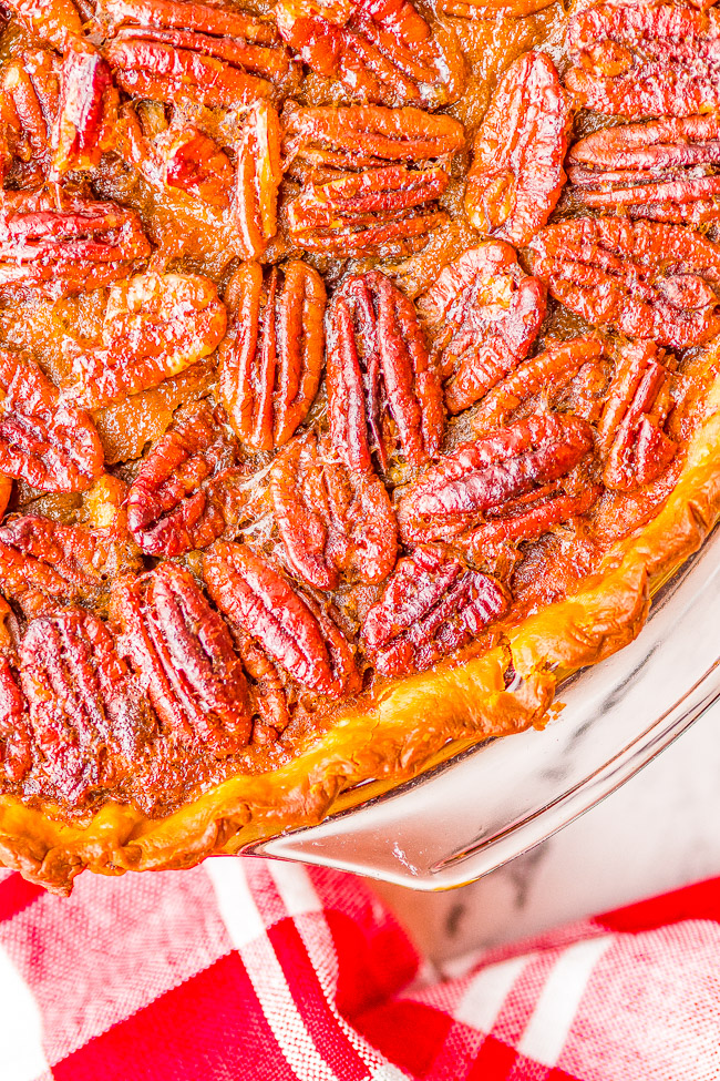 Pumpkin Pecan Pie - Merging two favorite pies in one so that the whole family can agree on a holiday dessert! This EASY pie is perfect for Thanksgiving, Christmas, holiday entertaining, and can be made in advance with store bought crust to save time!