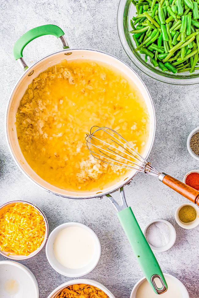 Slow Cooker Cheesy Green Bean Casserole - Fresh green beans are cooked with bacon and a THREE CHEESE sauce in the slow cooker to free up valuable oven space!  NO CANNED SOUP nor processed sauces here. An EASY comfort food side dish that's perfect for Thanksgiving, Christmas, parties, and events!