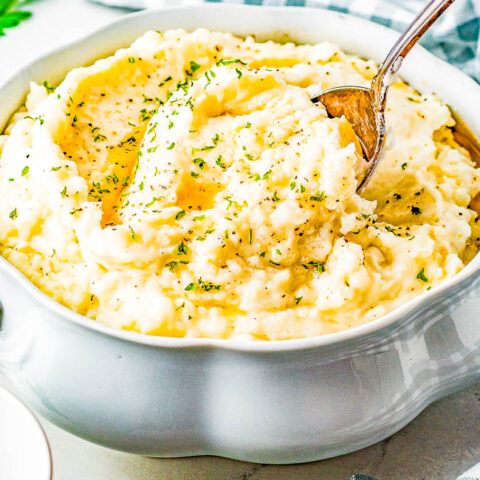 Slow Cooker Browned Butter Mashed Potatoes - Creamy and decadent from the herbed browned butter, these EASY mashed potatoes are a family favorite side dish! Made in the slow cooker to free up stove and oven space. No one will be able to resist these comforting buttery mashed potatoes at Thanksgiving, Christmas, or your next family gathering!