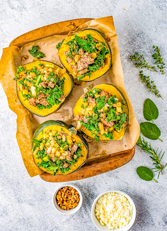 Stuffed Acorn Squash - Stuffed with a mixture of Italian sausage, celery, apple, kale, and seasoned with sage, rosemary, and thyme. This is the perfect fall dinner or hearty side dish recipe that's ready in under an hour! Healthy, easy, full of flavor and texture, and a very versatile recipe!