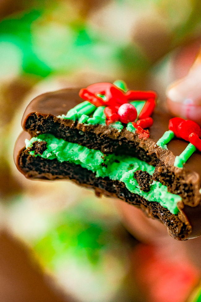 Chocolate Covered Christmas Oreos - Oreo cookies dipped in chocolate and loaded with sprinkles are an irresistible holiday treat! Fast, EASY, no-bake, can be made in advance! Perfect for cookie exchanges and hostess gifts. Get ready to break out the sprinkles and have fun making and then eating these family favorite Christmas cookies!