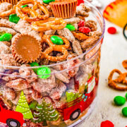 Loaded Christmas Puppy Chow in a festive bowl.