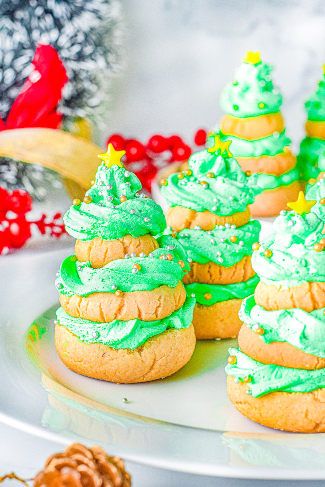 Stacked Christmas Tree Cookies - Softy, chewy, buttery sugar cookies are stacked in the shape of Christmas trees and layered with buttercream frosting! Fun and festive for the holidays and EASY to make! No need to roll out the dough nor chill it. A great holiday cookie to make with kids!