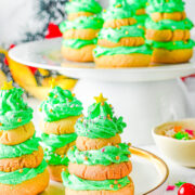 Stacked Christmas Tree Cookies - Softy, chewy, buttery sugar cookies are stacked in the shape of Christmas trees and layered with buttercream frosting! Fun and festive for the holidays and EASY to make! No need to roll out the dough nor chill it. A great holiday cookie to make with kids!