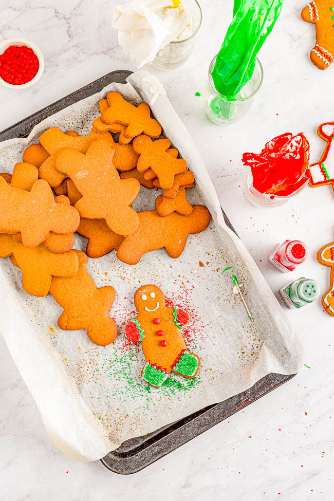 Classic Gingerbread Cookies - Soft and chewy cutout gingerbread cookies filled with plenty of ginger and warming spices! Decorated with a sweet, soft royal icing and topped with cinnamon candies, these gingerbread men are a nostalgic favorite Christmas cookie that everyone adores! 