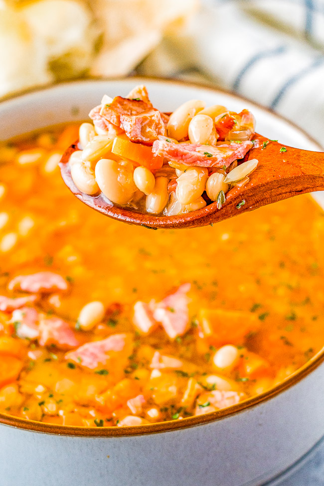 Slow Cooker Ham and Bean Soup - An incredibly EASY and comforting soup that can be made with leftover holiday ham or deli ham! Your slow cooker does all the work to meld the flavors together. OR you can also make this on the stove top in 30 minutes!