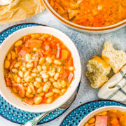 Overhead image of bowls of crock pot ham and bean soup.