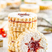 A stack of Snowflake Linzer Cookies.