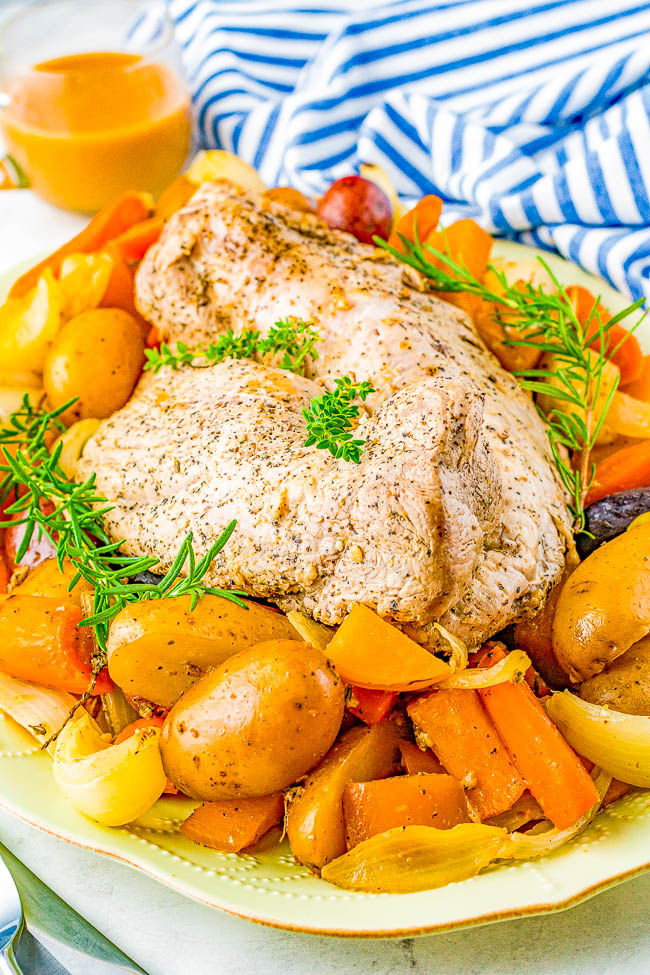 Slow Cooker Pork Loin - Tender, juicy pork loin is slow cooked with hearty vegetables for a complete and EASY meal! Reminiscent of a hearty and rustic recipe, yet fancy enough for a special dinner or holiday entertaining!