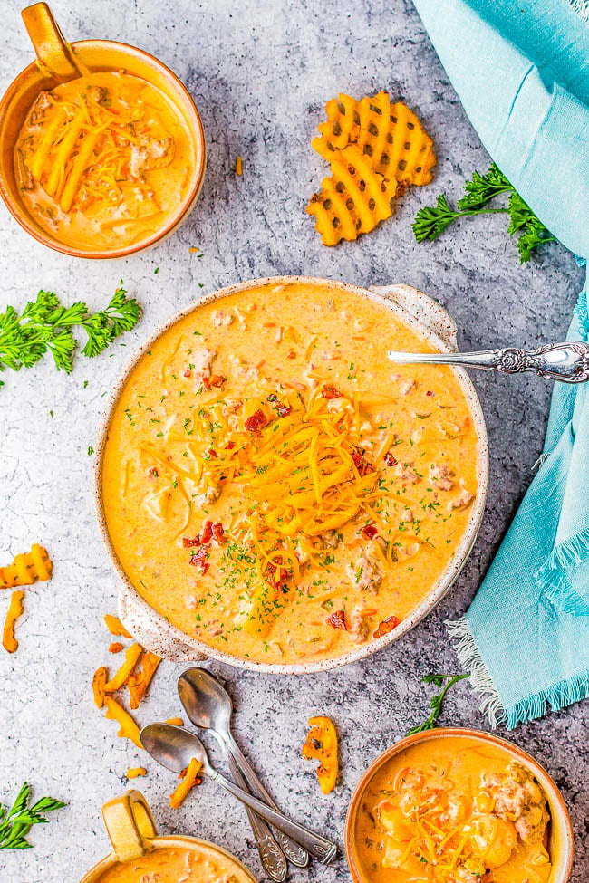 Crockpot Cheeseburger Soup - A decadent dish that's like eating a loaded cheeseburger, but in soup form! Ground beef, bacon, cheese, and an array of vegetables give fantastic depth of flavor. SO EASY because your slow cooker does ALL the work! A guaranteed family favorite especially when it's chilly.