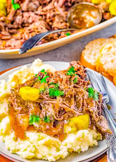 Slow Cooker Mississippi Pot Roast - A foolproof recipe for tender, juicy pot roast with just FIVE main ingredients! Your slow cooker does all the work in this comfort food classic pot roast that the whole family will adore! EASIER than any pot roast you will ever make and with more robust flavor!