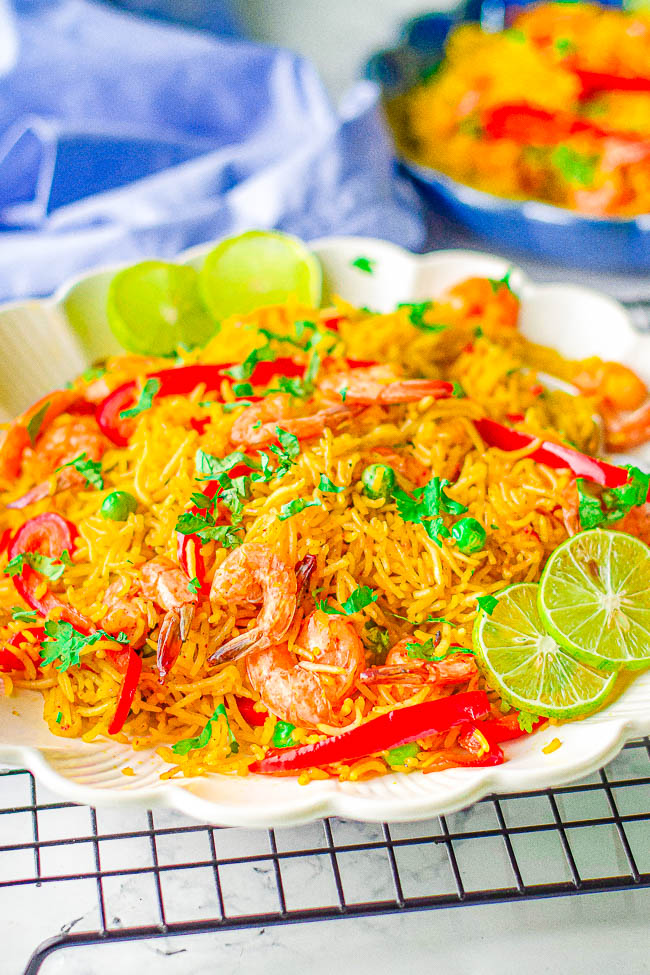 Instant Pot Shrimp Paella - All the rich flavors of classic Spanish paella but made in your Instant Pot and ready in 25 minutes! Plump and juicy shrimp, crisp-tender bell peppers and peas, all tossed in saffron and paprika seasoned rice! An EASY recipe that's perfect for busy weeknights!