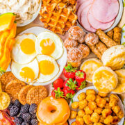 How To Make a Brunch Board - Nothing says relaxation and pampering like a brunch or breakfast board that's loaded with everyone's morning favorites! Whether you include eggs, meats, cheeses, fresh fruits, or all the craveworthy carbs, it's sure to be a hit! PERFECT for weekend brunches or special holiday mornings like Easter, Mother's Day, Christmas, or New Year's! Use ready-made foods from your bakery or grocery store so all that remains is FAST and EASY assembly!