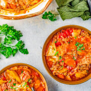 Slow Cooker Cabbage Roll Soup - A hearty comfort food soup recipe the whole family will love. If you think that soup can't be a meal, guess again! This slow cooker soup is chock full of bacon, ground beef, green cabbage, rice, carrots, fire roasted tomatoes, and more! Perfect for chilly weather, busy weeknights, and the leftovers freeze great! 