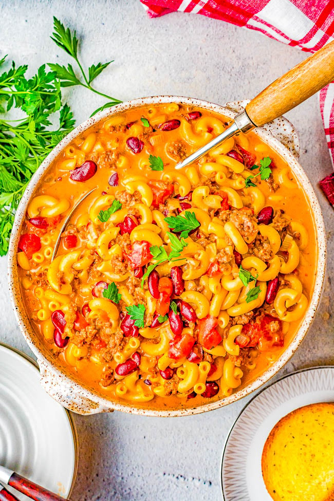 Instant Pot Chili Mac and Cheese - Hearty chili mac made with ground beef, onions, tomatoes, kidney beans, and two types of melted CHEESE! EASY, ready in 20 minutes, and a cheesy comfort food family favorite that's perfect for busy weeknights! Stovetop directions provided if you don't have an Instant Pot.