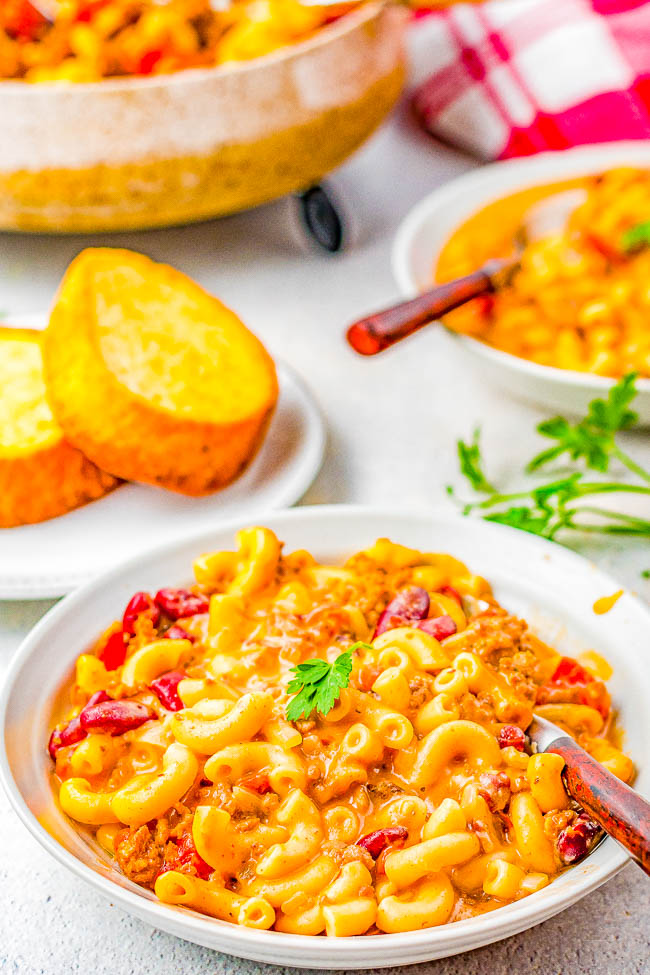 Instant Pot Chili Mac and Cheese - Hearty chili mac made with ground beef, onions, tomatoes, kidney beans, and two types of melted CHEESE! EASY, ready in 20 minutes, and a cheesy comfort food family favorite that's perfect for busy weeknights! Stovetop directions provided if you don't have an Instant Pot. 