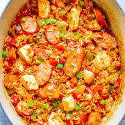 Easy One Pot Jambalaya with Sausage and Chicken - This EASY jambalaya is made in ONE pot with Cajun-seasoned chicken, sausage, rice, peppers, and more! The whole family will LOVE this big batch of comfort food that's ready in 30 MINUTES! Perfect for busy weeknights or make it as a freezer meal prep recipe. There's such incredible depth of flavor in such a short amount of time that it'll be sure to go into your rotation!