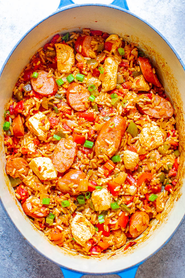 Easy One Pot Jambalaya with Sausage and Chicken - This EASY jambalaya is made in ONE pot with Cajun-seasoned chicken, sausage, rice, peppers, and more! The whole family will LOVE this big batch of comfort food that's ready in 30 MINUTES! Perfect for busy weeknights or make it as a freezer meal prep recipe. There's such incredible depth of flavor in such a short amount of time that it'll be sure to go into your rotation!