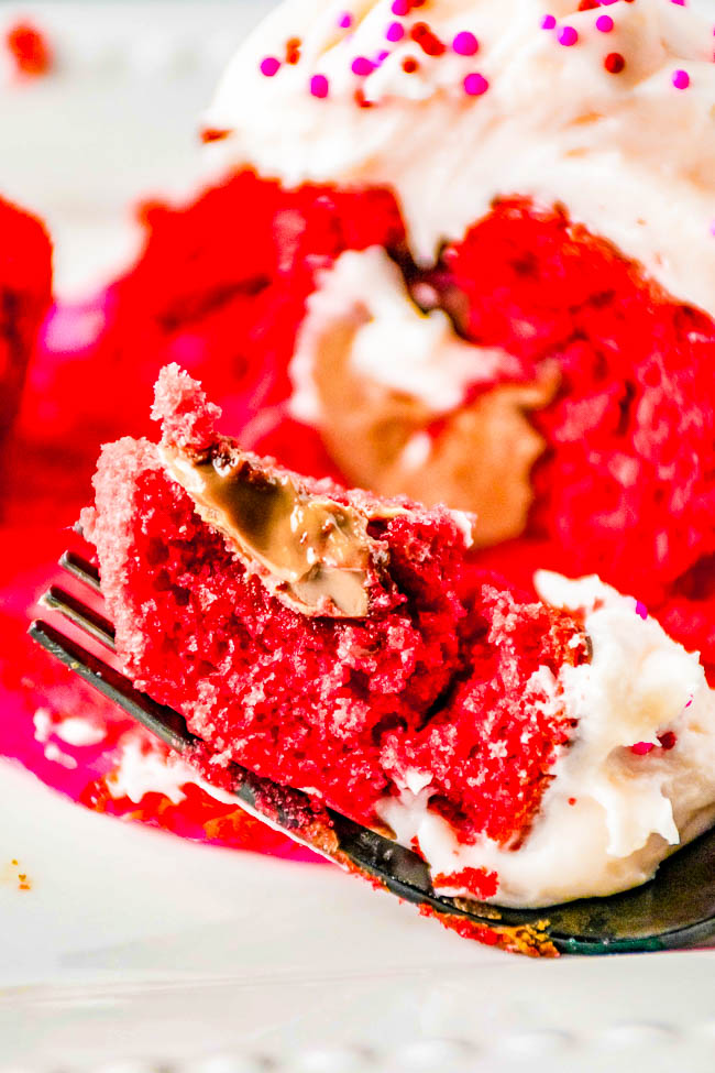 Chocolate Truffle Red Velvet Cupcakes – Tender fluffy red velvet cupcakes stuffed with chocolate truffles and topped with sweet and tangy cream cheese frosting! EASY to make and the PERFECT Valentine’s Day or holiday treat sure to impress your family and friends! 