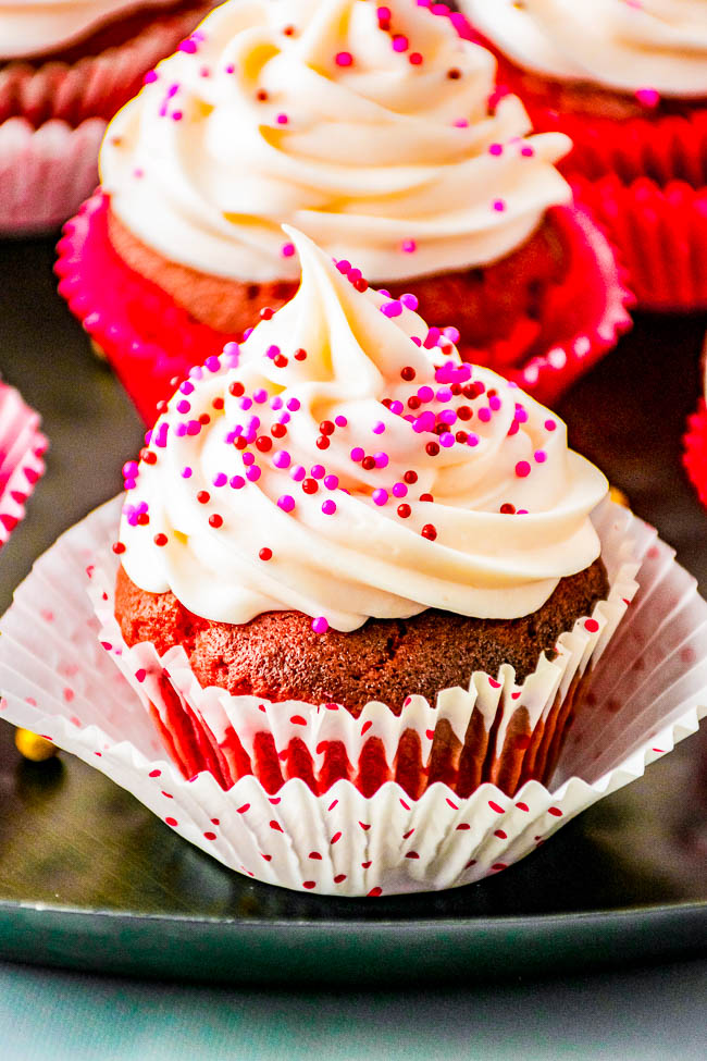 Chocolate Truffle Red Velvet Cupcakes – Tender fluffy red velvet cupcakes stuffed with chocolate truffles and topped with sweet and tangy cream cheese frosting! EASY to make and the PERFECT Valentine’s Day or holiday treat sure to impress your family and friends! 